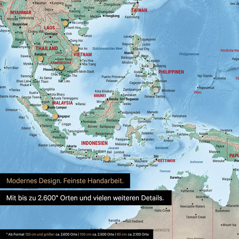 Détail d'une carte physique magnétique multicolore Terra montrant la carte de l'Asie, avec des aimants marquant des destinations de voyage