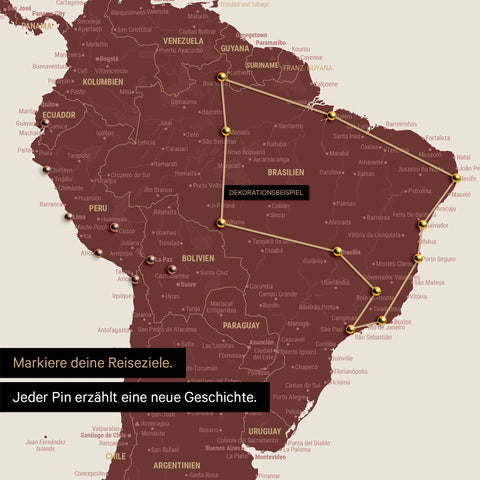 Détail d'une carte du monde en Carte à épingles couleur Bordeaux rouge avec des épingles montrant un itinéraire de voyage tracé en Amérique du Sud à travers les pays Brésil, Pérou et Équateur