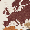 A detailed section of a multicolor vivid world map pinboard shows a part of Europe with all countries and capitals.