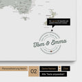 Personalized world map as a pinboard canvas in multicolor sage with printed names and a legend for marking visited places